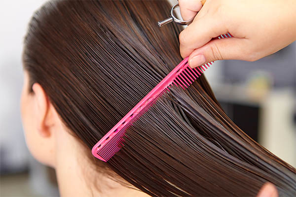 hair combing during Brazilian keratin application