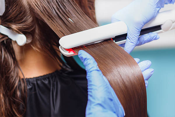 hair straightening with a flat iron